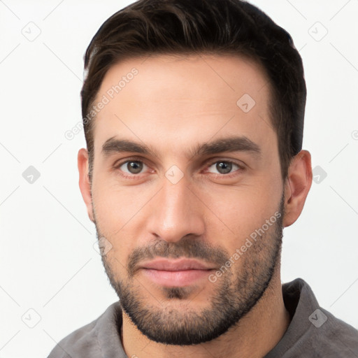 Neutral white young-adult male with short  brown hair and brown eyes