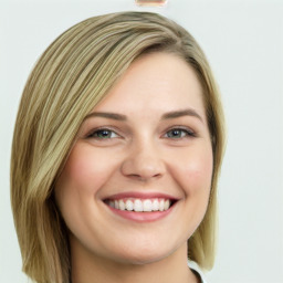 Joyful white young-adult female with long  brown hair and green eyes