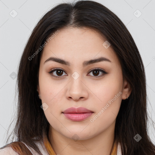 Joyful asian young-adult female with long  brown hair and brown eyes