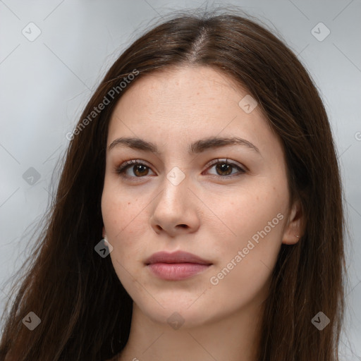 Neutral white young-adult female with long  brown hair and brown eyes