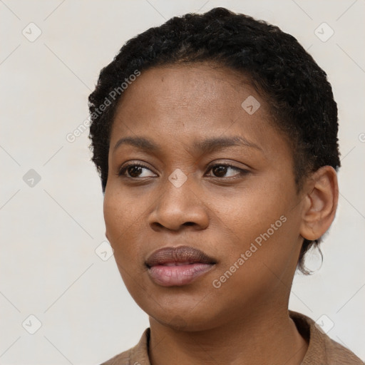 Neutral black young-adult female with short  black hair and brown eyes