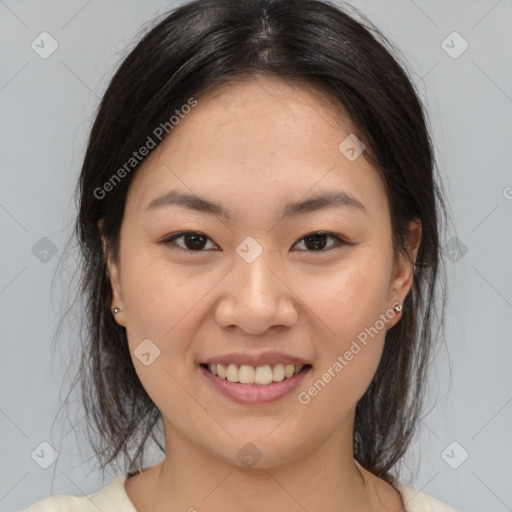 Joyful asian young-adult female with medium  brown hair and brown eyes