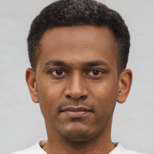 Neutral latino young-adult male with short  brown hair and brown eyes
