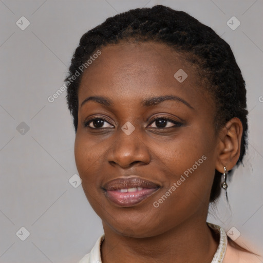 Joyful black young-adult female with medium  black hair and brown eyes