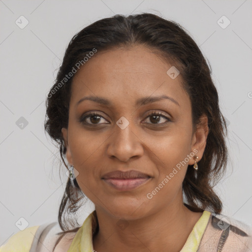 Joyful black adult female with medium  brown hair and brown eyes
