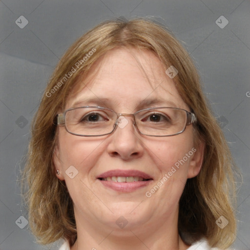 Joyful white adult female with medium  brown hair and blue eyes