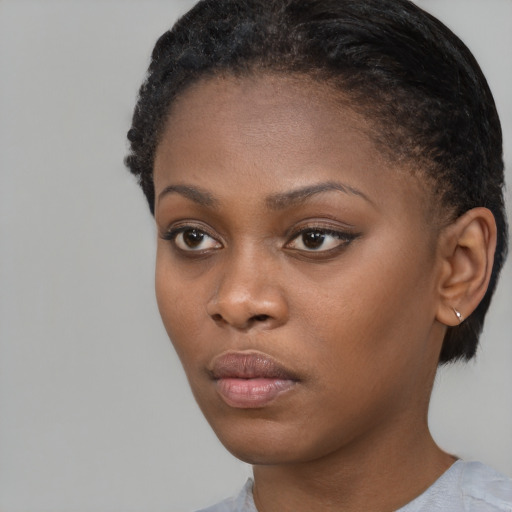 Neutral black young-adult female with short  black hair and brown eyes