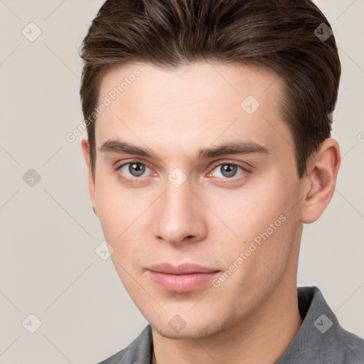 Neutral white young-adult male with short  brown hair and grey eyes