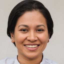 Joyful white young-adult female with short  brown hair and brown eyes