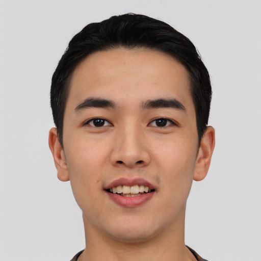 Joyful asian young-adult male with short  black hair and brown eyes