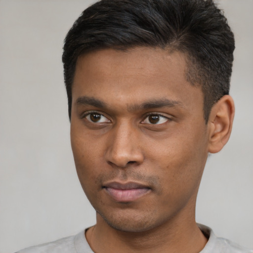 Neutral latino young-adult male with short  brown hair and brown eyes