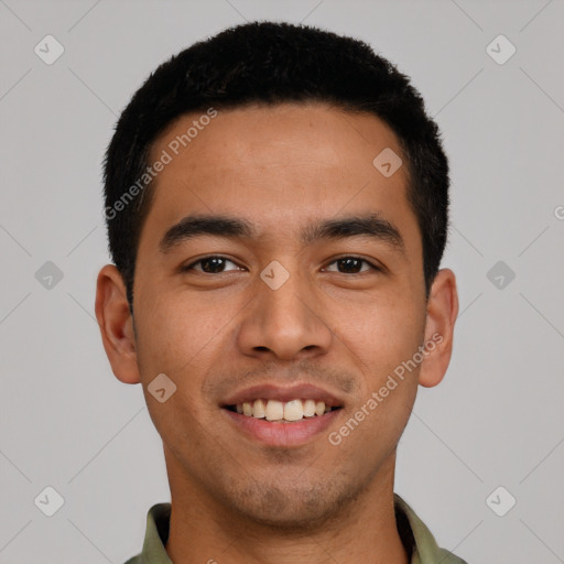 Joyful latino young-adult male with short  black hair and brown eyes