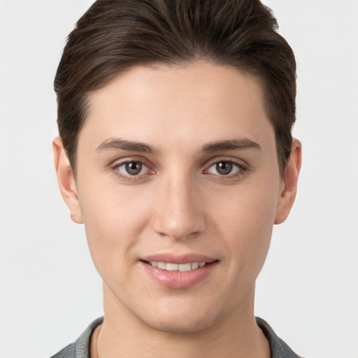 Joyful white young-adult female with short  brown hair and brown eyes