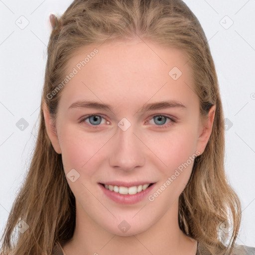 Joyful white young-adult female with long  brown hair and grey eyes