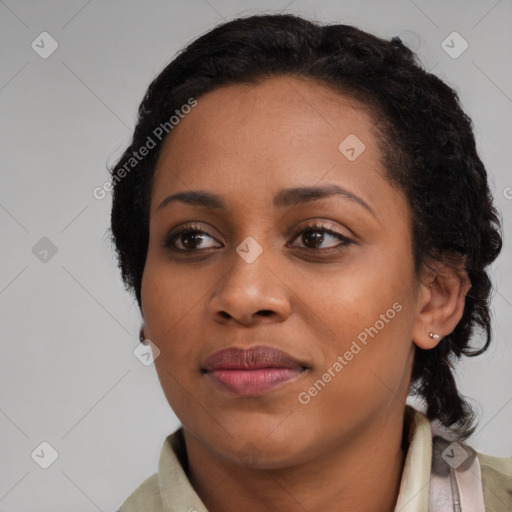 Joyful black young-adult female with medium  black hair and brown eyes