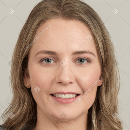 Joyful white young-adult female with long  brown hair and green eyes