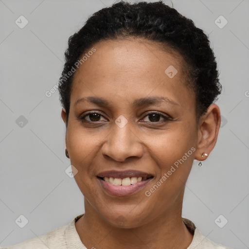 Joyful black young-adult female with short  brown hair and brown eyes