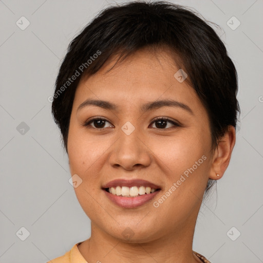 Joyful asian young-adult female with short  brown hair and brown eyes