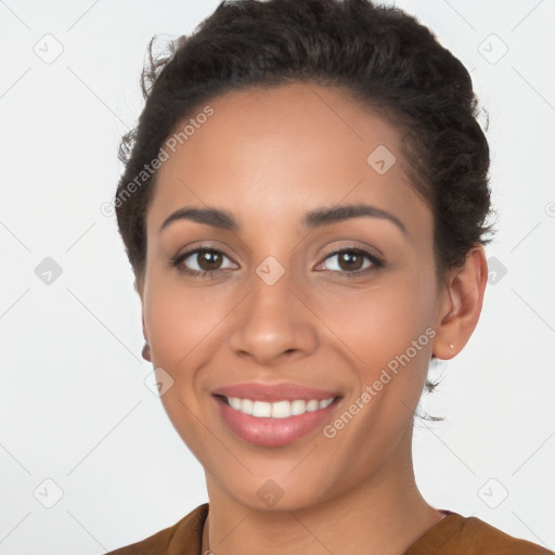 Joyful latino young-adult female with short  brown hair and brown eyes