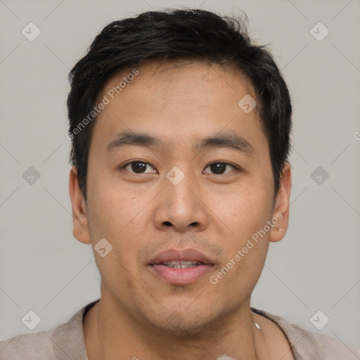 Joyful asian young-adult male with short  brown hair and brown eyes