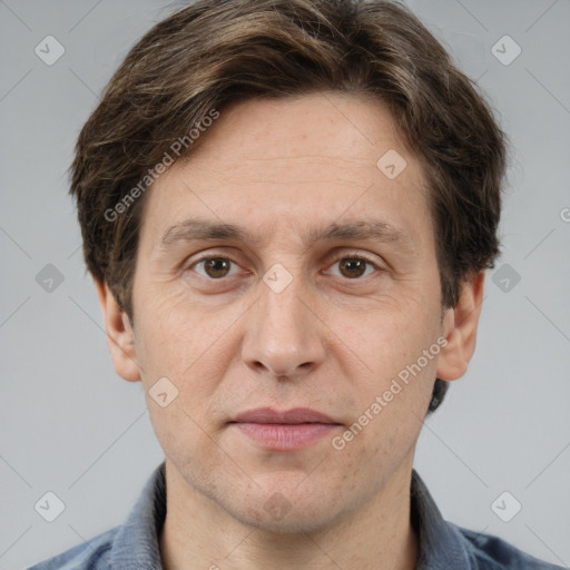 Joyful white adult male with short  brown hair and grey eyes