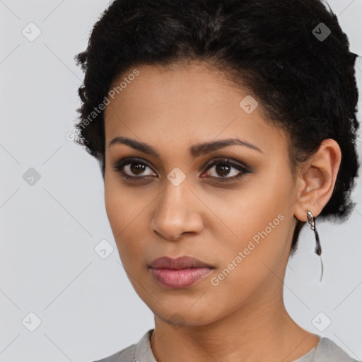 Joyful latino young-adult female with short  brown hair and brown eyes