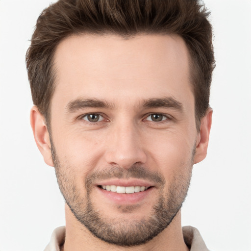 Joyful white young-adult male with short  brown hair and brown eyes