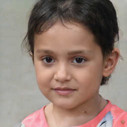 Joyful white child female with short  brown hair and brown eyes