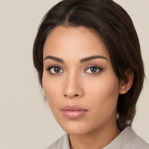 Neutral white young-adult female with medium  brown hair and brown eyes