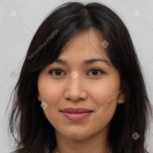 Joyful latino young-adult female with long  brown hair and brown eyes