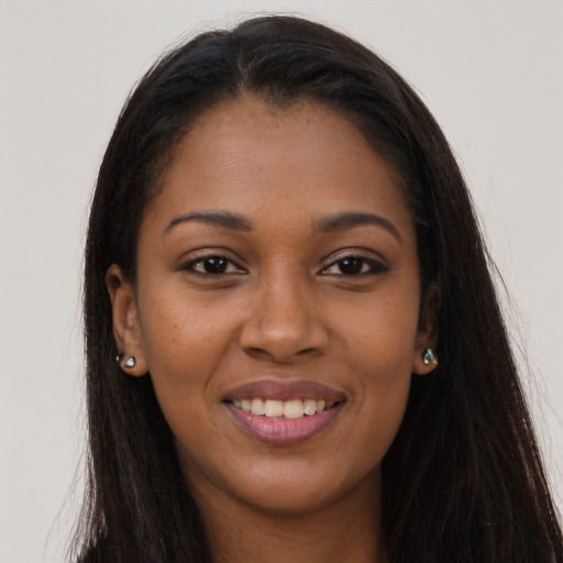 Joyful asian young-adult female with long  brown hair and brown eyes