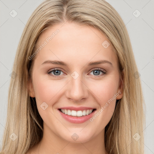 Joyful white young-adult female with long  brown hair and blue eyes