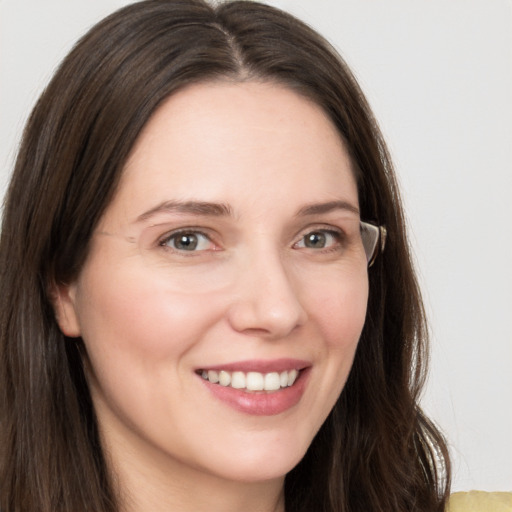 Joyful white young-adult female with long  brown hair and grey eyes