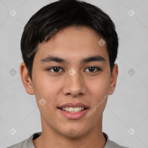 Joyful asian young-adult male with short  brown hair and brown eyes