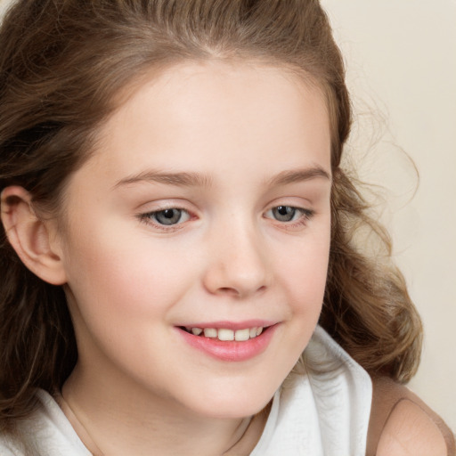 Joyful white child female with long  brown hair and brown eyes