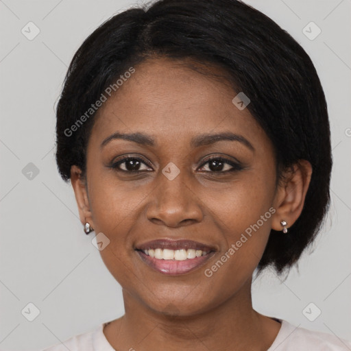 Joyful black young-adult female with short  black hair and brown eyes