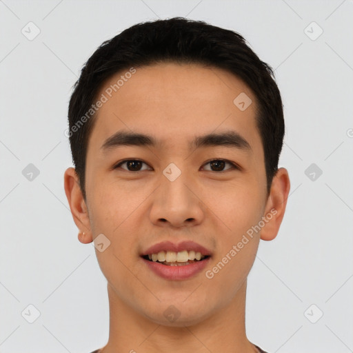 Joyful asian young-adult male with short  black hair and brown eyes