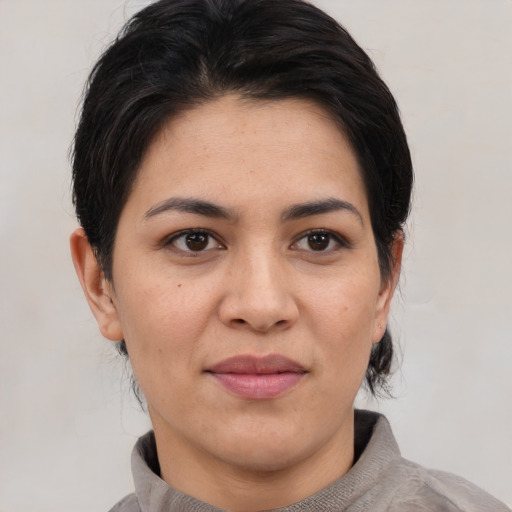 Joyful asian young-adult female with medium  black hair and brown eyes