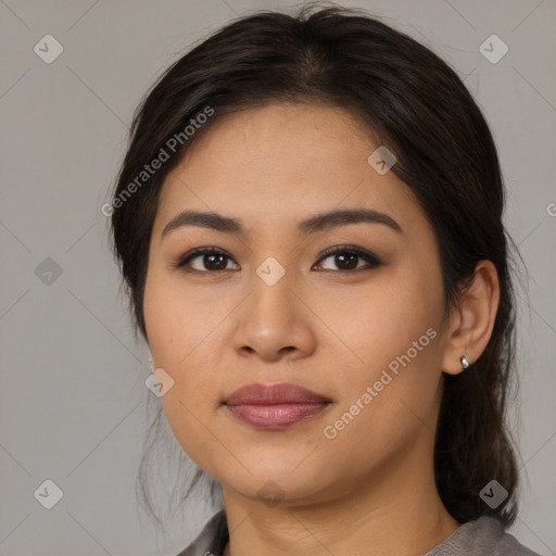 Joyful asian young-adult female with medium  brown hair and brown eyes