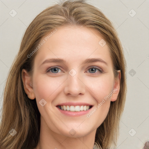 Joyful white young-adult female with long  brown hair and blue eyes