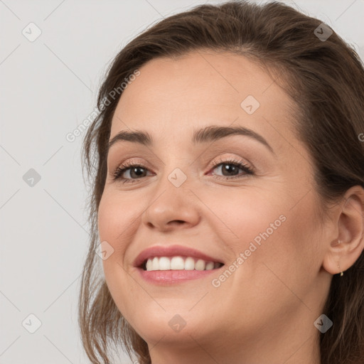 Joyful white young-adult female with long  brown hair and grey eyes