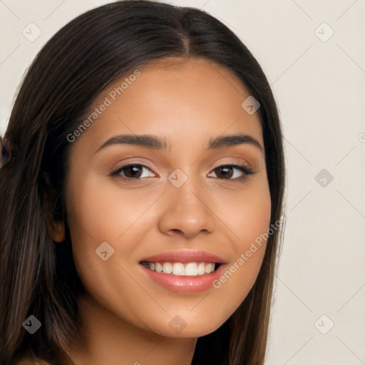 Joyful latino young-adult female with long  brown hair and brown eyes