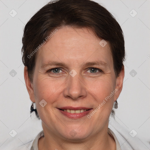 Joyful white adult female with short  brown hair and brown eyes