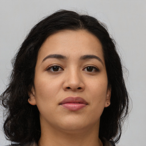 Joyful asian young-adult female with long  brown hair and brown eyes