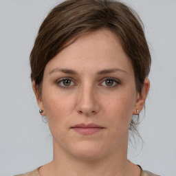 Neutral white young-adult female with medium  brown hair and grey eyes