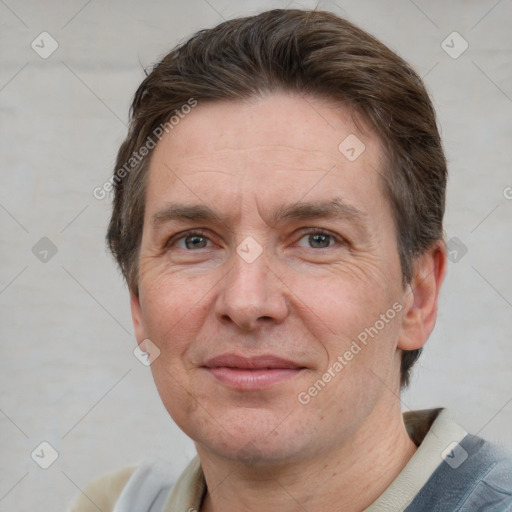 Joyful white adult male with short  brown hair and grey eyes