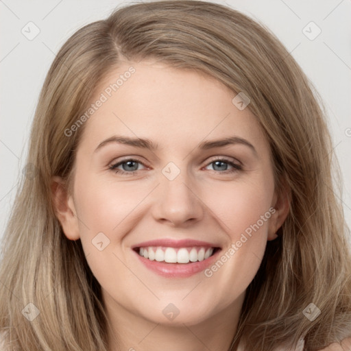 Joyful white young-adult female with long  brown hair and grey eyes