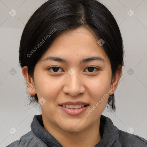 Joyful asian young-adult female with medium  black hair and brown eyes