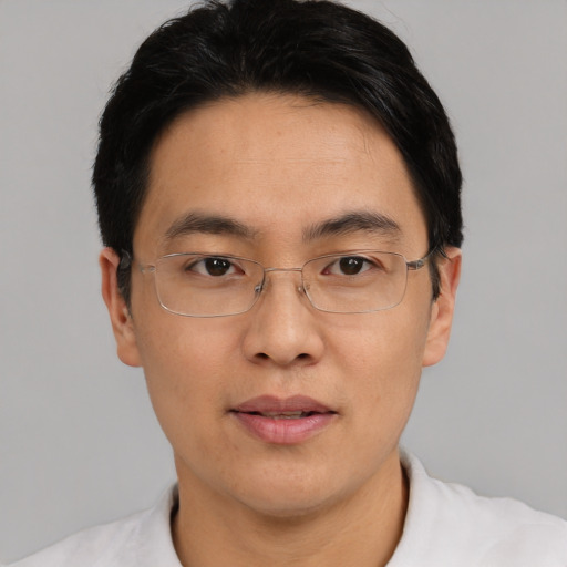 Neutral asian adult male with short  black hair and brown eyes