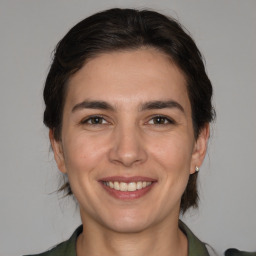 Joyful white young-adult female with medium  brown hair and brown eyes